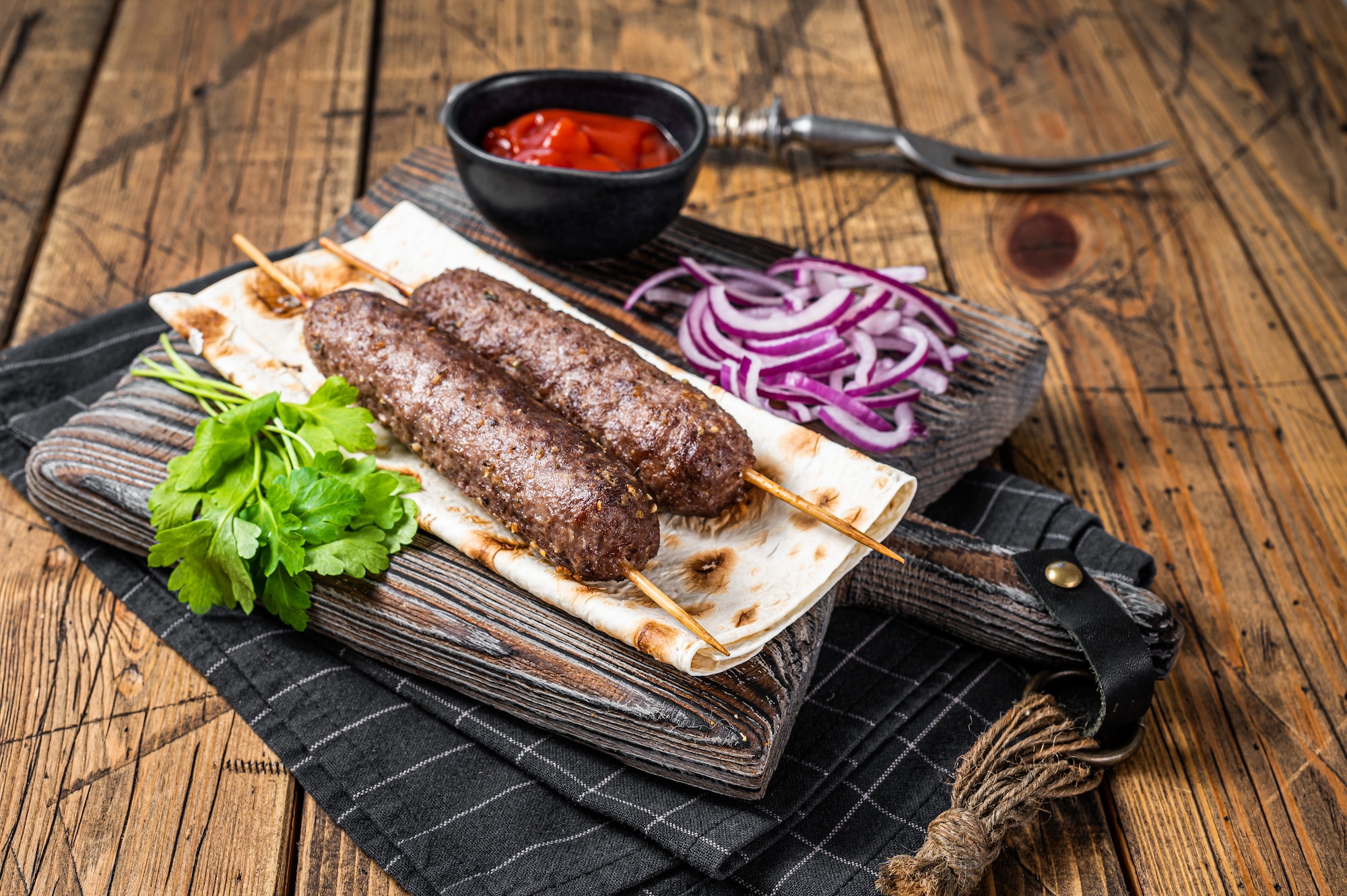 Traditional middle east kefta, kofta kebab from ground beef and lamb meat grilled on skewers served